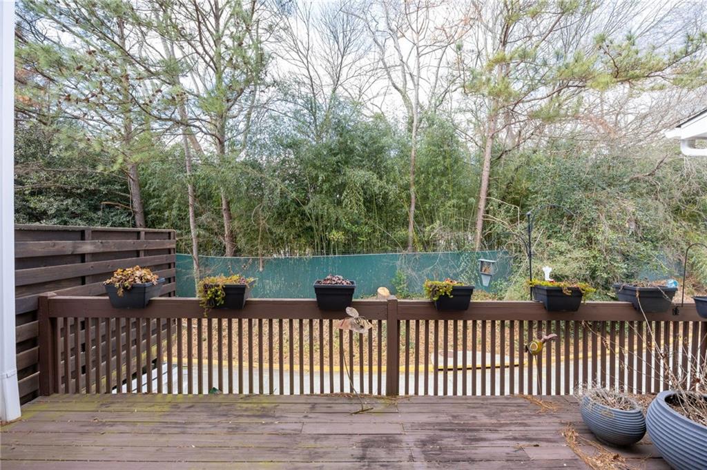 260 Manning Road Southwest, Unit 136 Marietta, GA 30064 - Photo 34 of 43 a view of deck and yard with trees in the background