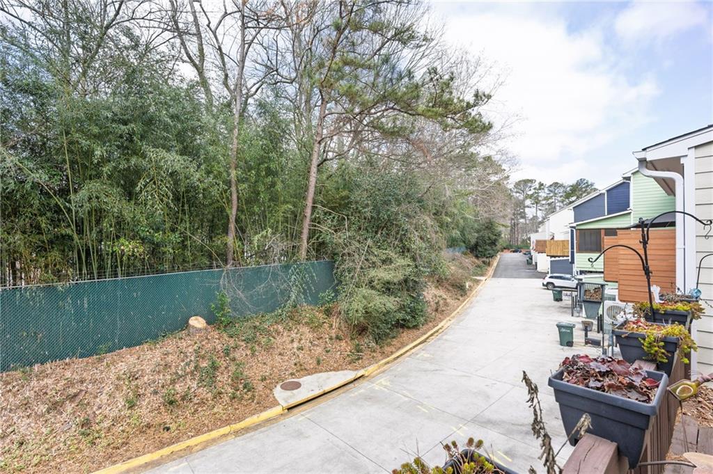 260 Manning Road Southwest, Unit 136 Marietta, GA 30064 - Photo 37 of 43 a view of a lake with a patio