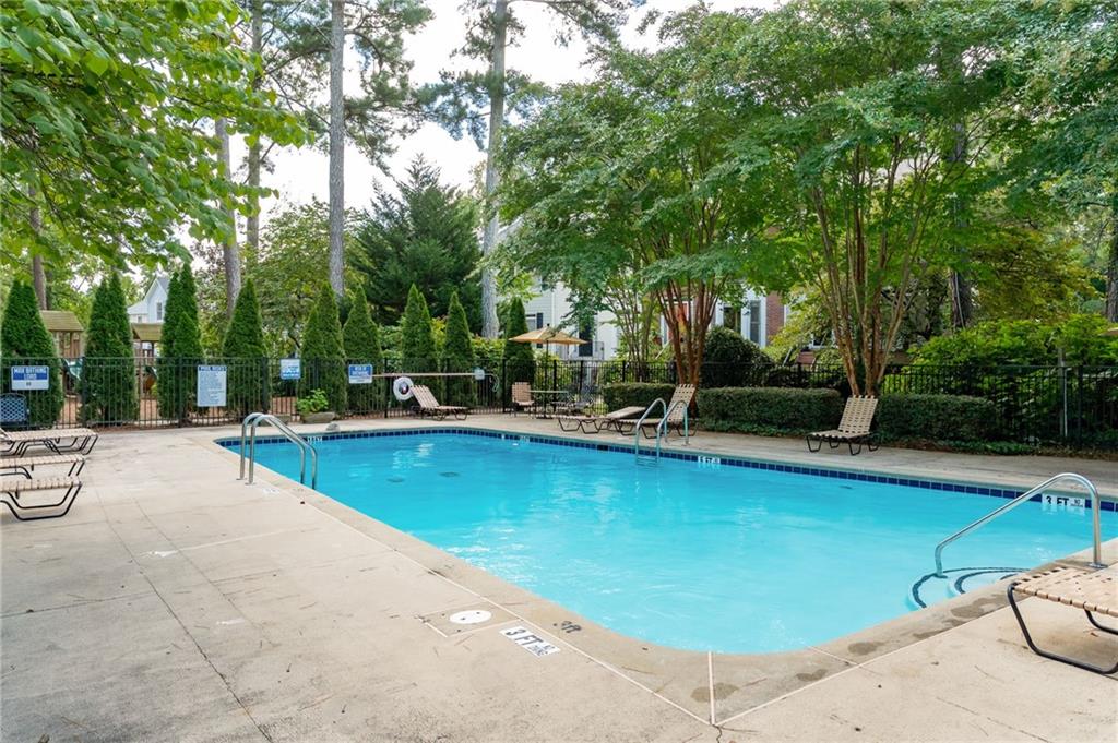 260 Manning Road Southwest, Unit 136 Marietta, GA 30064 - Photo 40 of 43 a view of a swimming pool with chairs