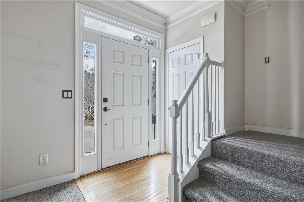 260 Manning Road Southwest, Unit 136 Marietta, GA 30064 - Photo 6 of 43 a view of a hallway with entryway window and stairs