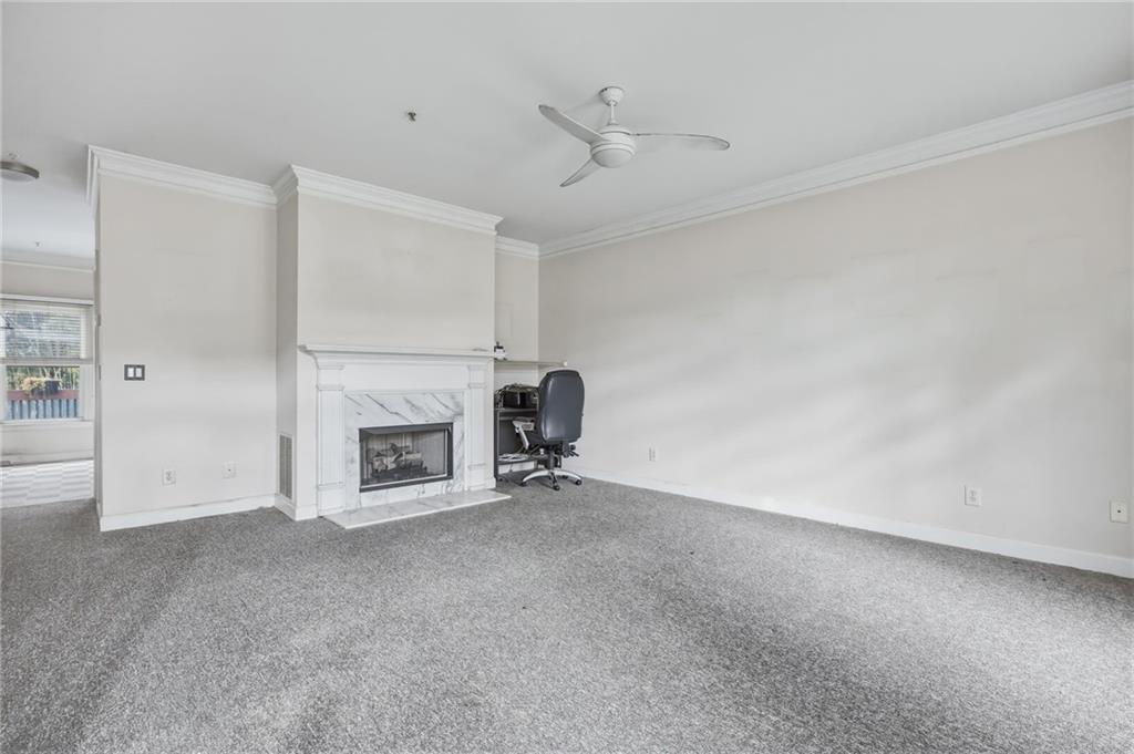 260 Manning Road Southwest, Unit 136 Marietta, GA 30064 - Photo 7 of 43 a view of a livingroom with a fireplace and a window