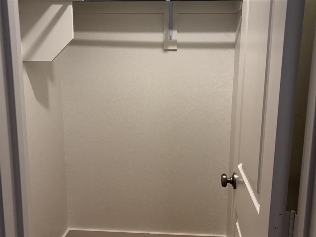 2828 Walden Road Celina, TX 75009 - Photo 18 of 30 Built-in closet shelving with an integrated hanging rod