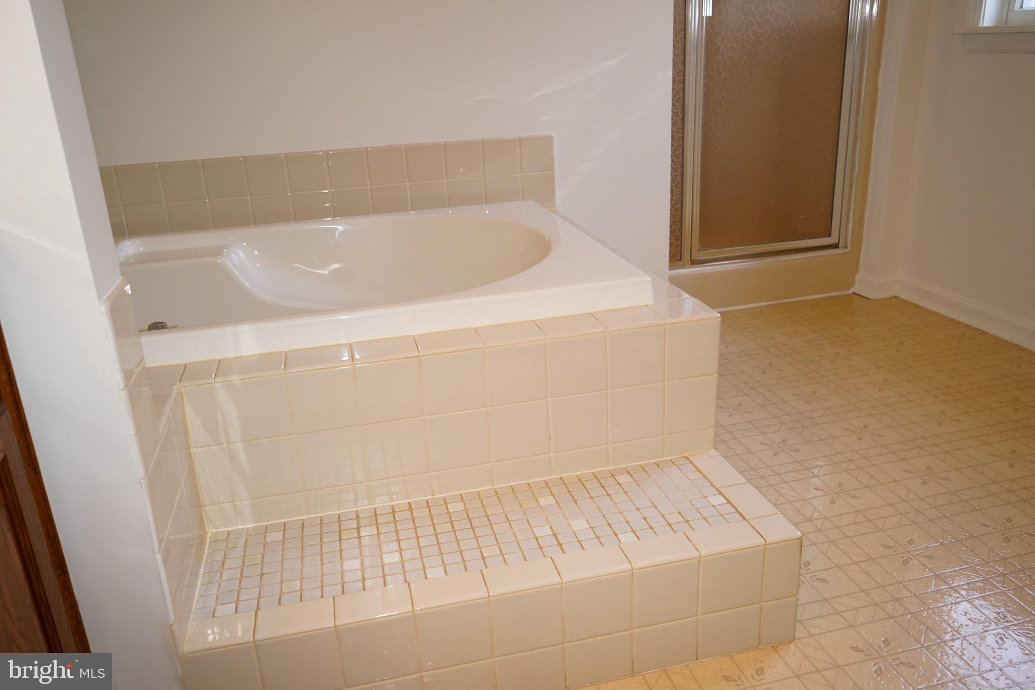 7323 O'Keefe Road Bealeton, VA 22712 - Photo 31 of 48 Elegant bathroom with a sunken tub design.