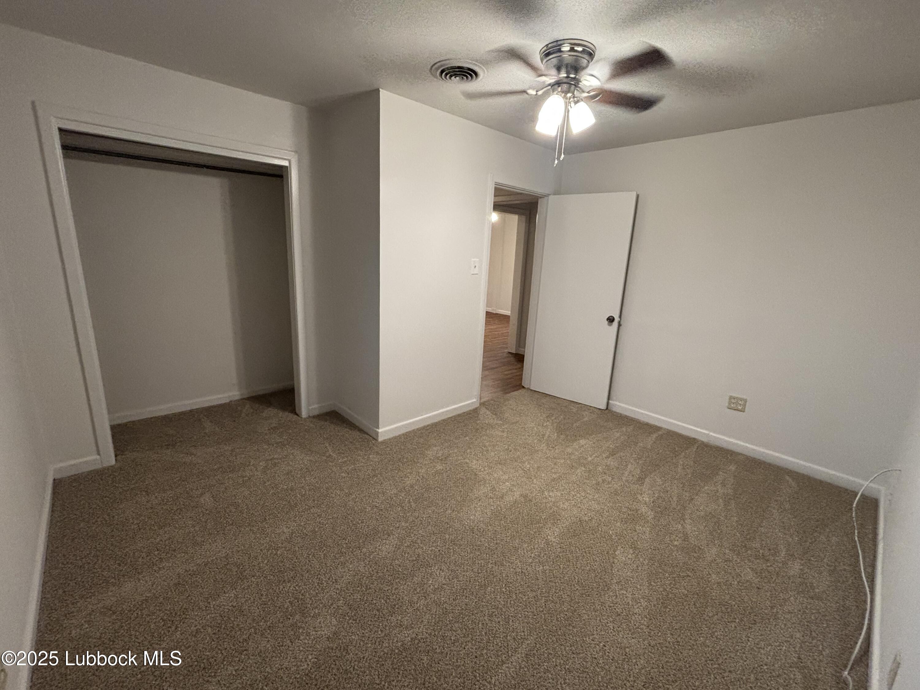 1301 6th Street Shallowater, TX 79363 - Photo 13 of 15 a view of a chandelier fan in a room