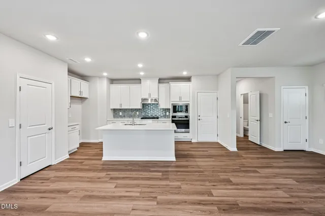 a view of kitchen with wooden floor