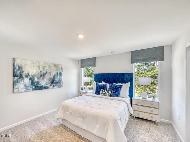 a view of a workspace with furniture and window