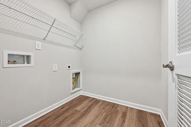 a view of room with window and hardwood floor