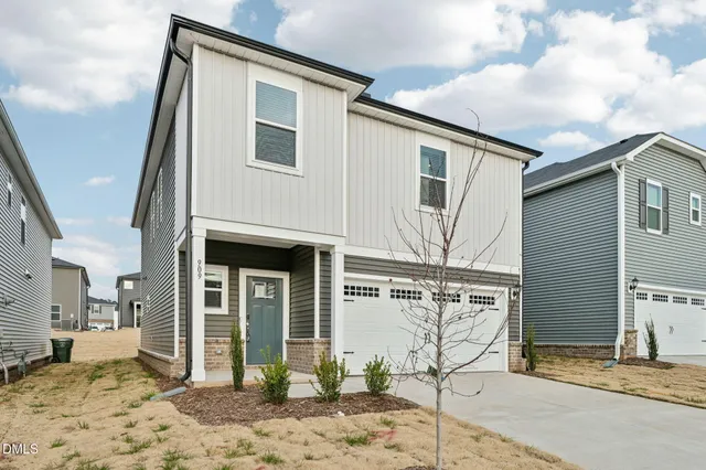 a view of a house with a street