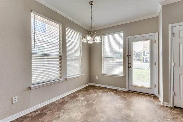 a view of an empty room with a windows