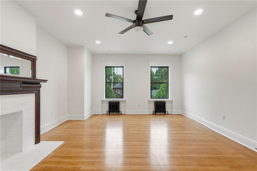 4749 Wallingford Street Pittsburgh, PA 15213 - Photo 35 of 49 a view of empty room with wooden floor and fan