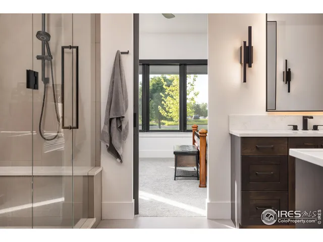 a en suite bathroom with a granite countertop sink