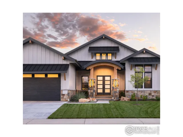 a view of a house with a yard and potted plants