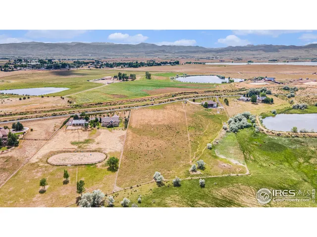 a bathroom with a swimming pool and a yard