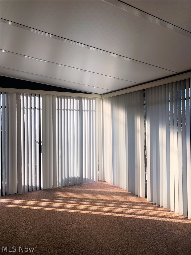 587 West Nimisila Road Akron, OH 44319 - Photo 10 of 35 Other side of enclosed porch, vertical blinds closed