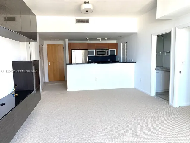 a view of a living room with a flat screen tv