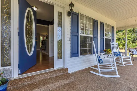 a front view of a house with outdoor space and windows