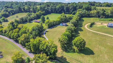a view of a chair and tables in the balcony