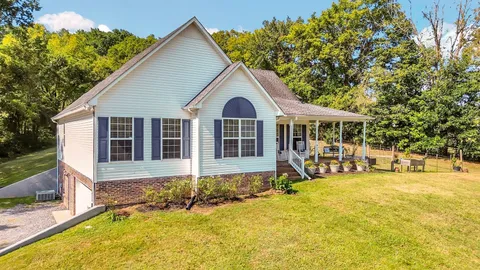 a view of a lake with a yard