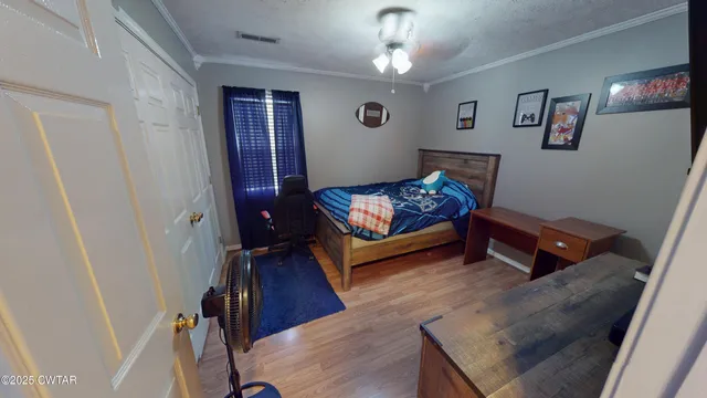 a view of a backyard with table and chairs