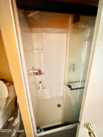 a bathroom with a sink and a shower