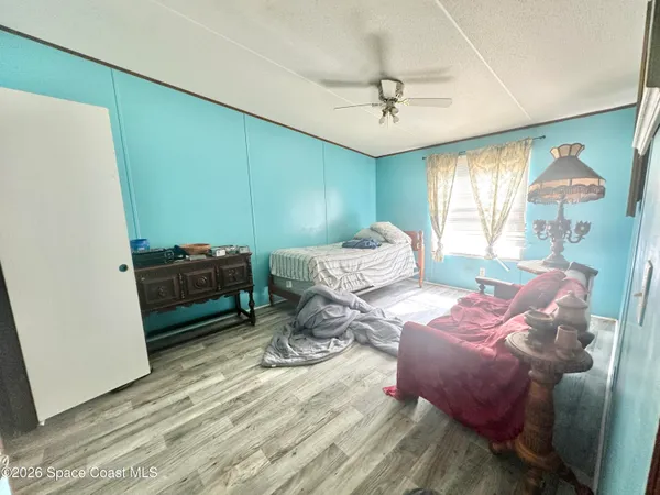 a bedroom with furniture and a window