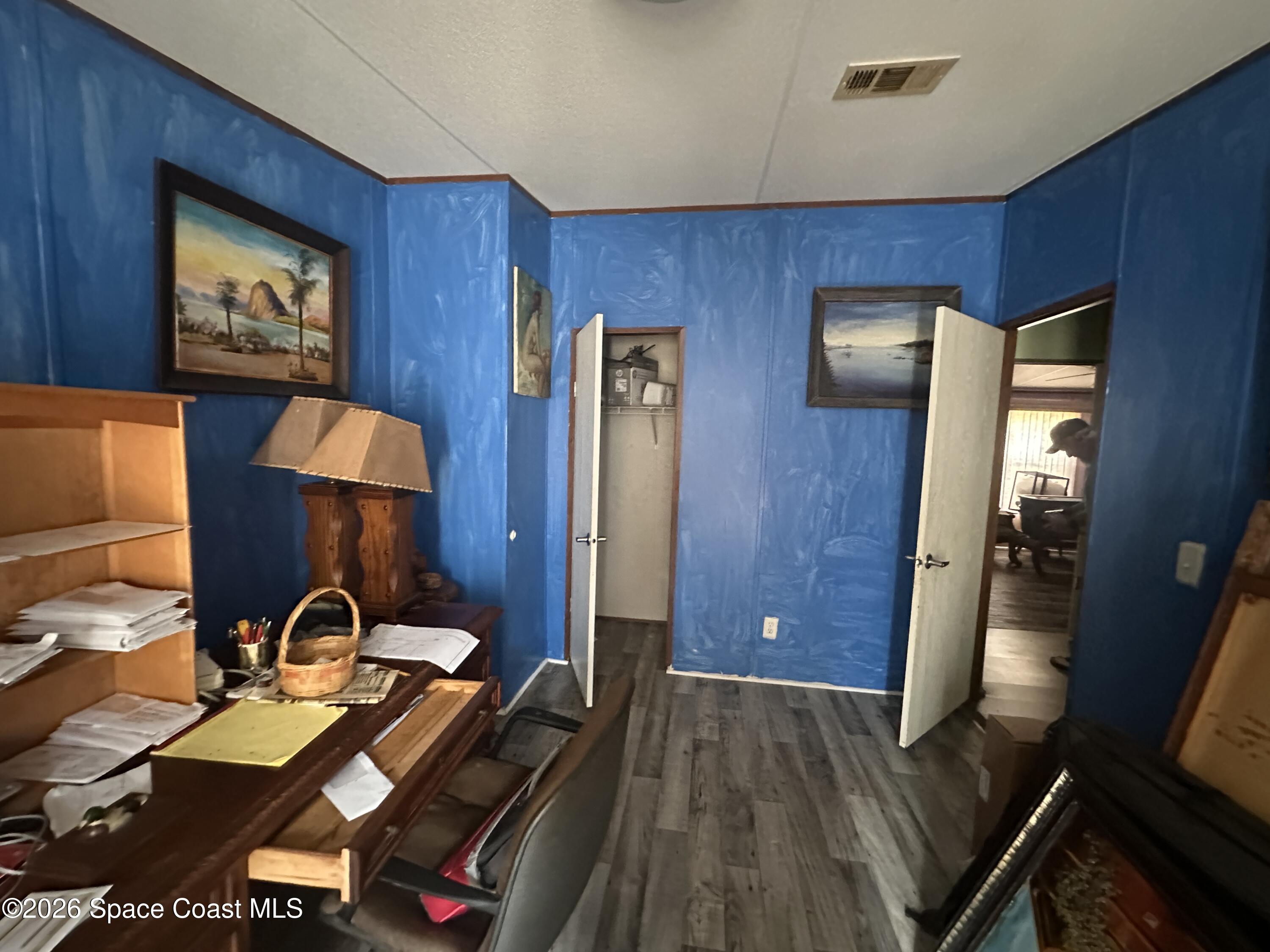 3550 Arbor Avenue Bunnell, FL 32110 - Photo 16 of 21 a view of a workspace with furniture and wooden floor