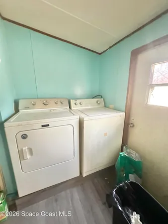 a utility room with dryer and washer