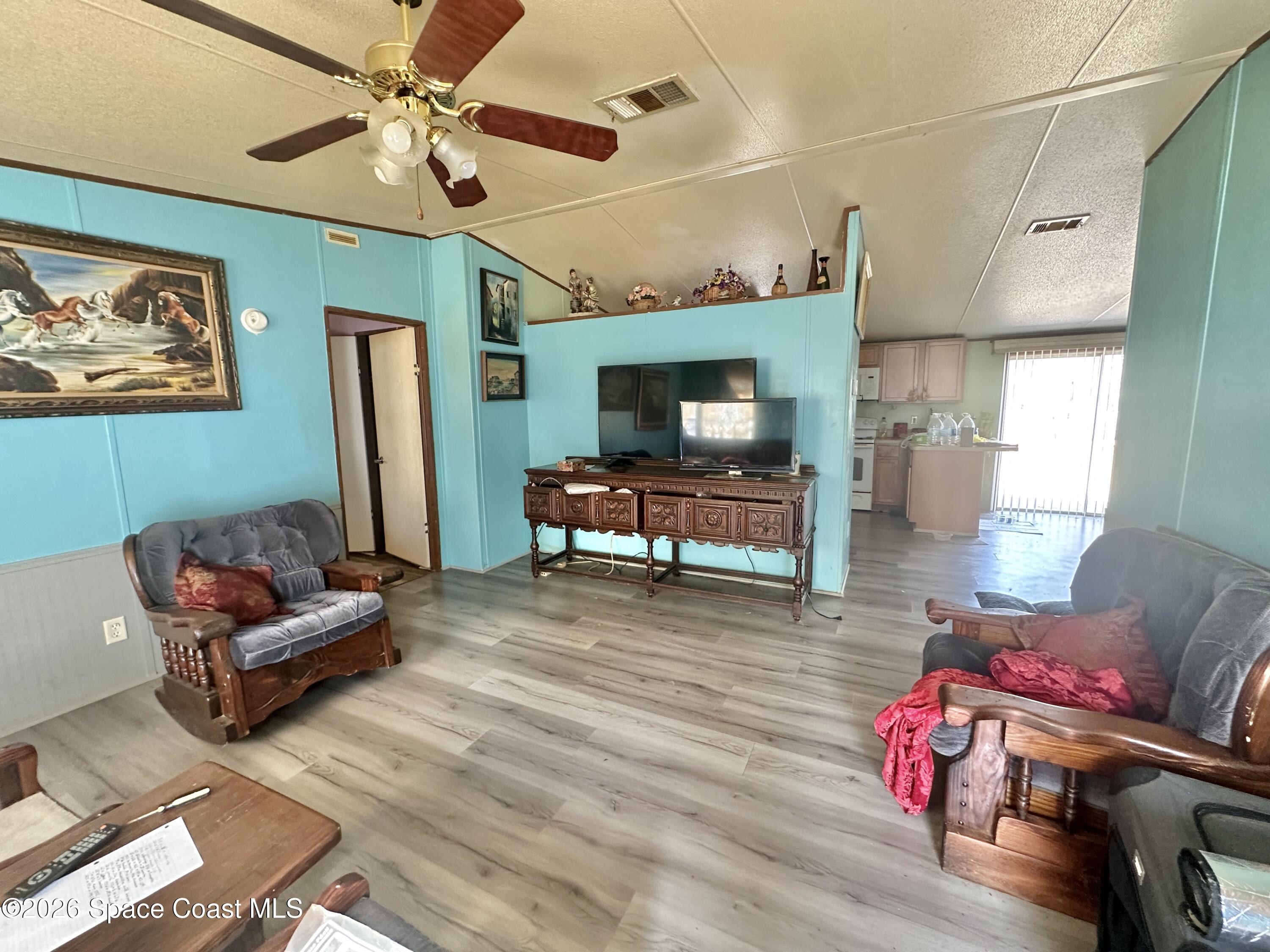 3550 Arbor Avenue Bunnell, FL 32110 - Photo 5 of 21 a living room with furniture and a wooden floor