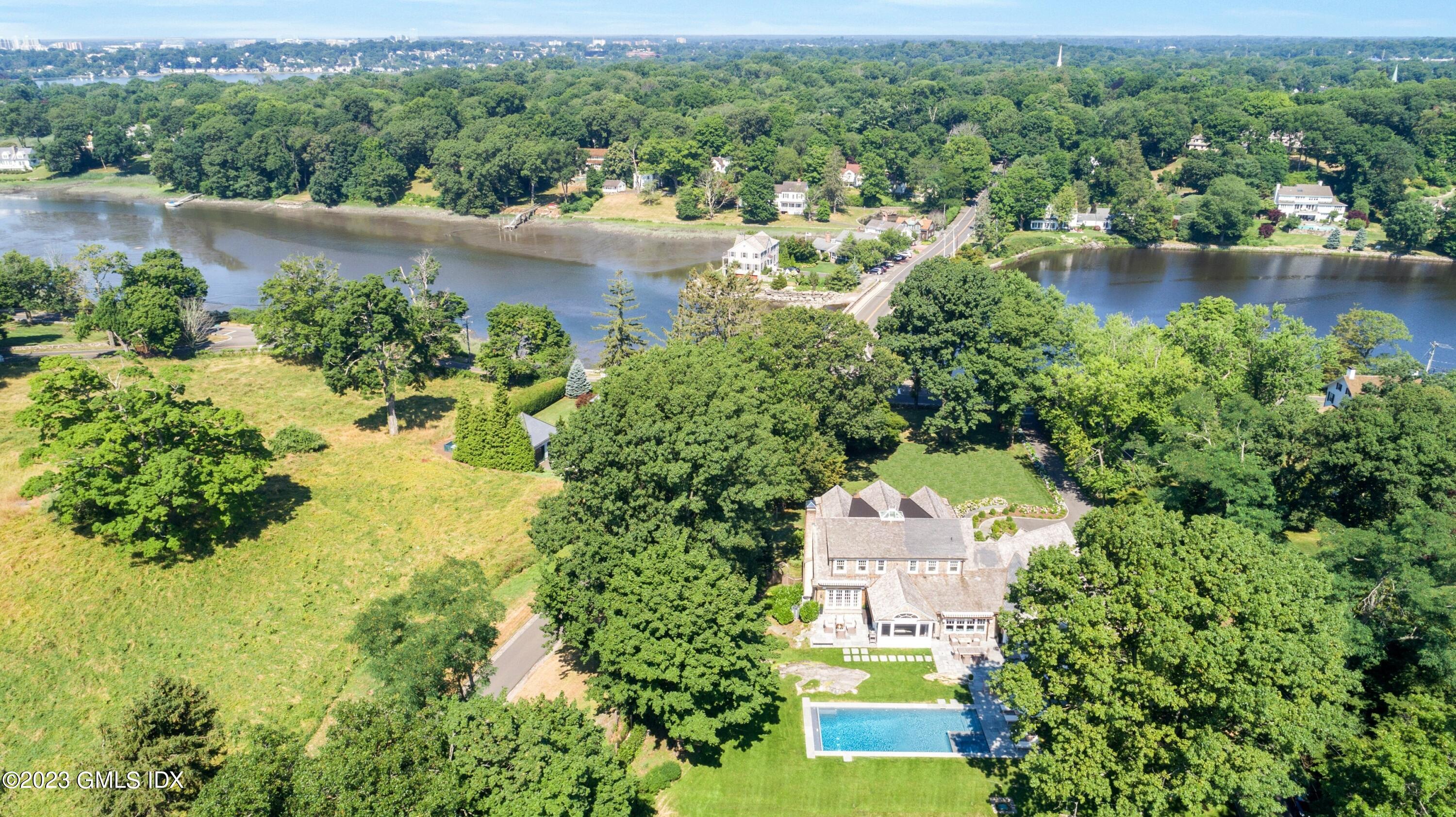 150 Goodwives River Road Darien, CT 06820 - Photo 1 of 39 an aerial view of a house with a yard and lake view