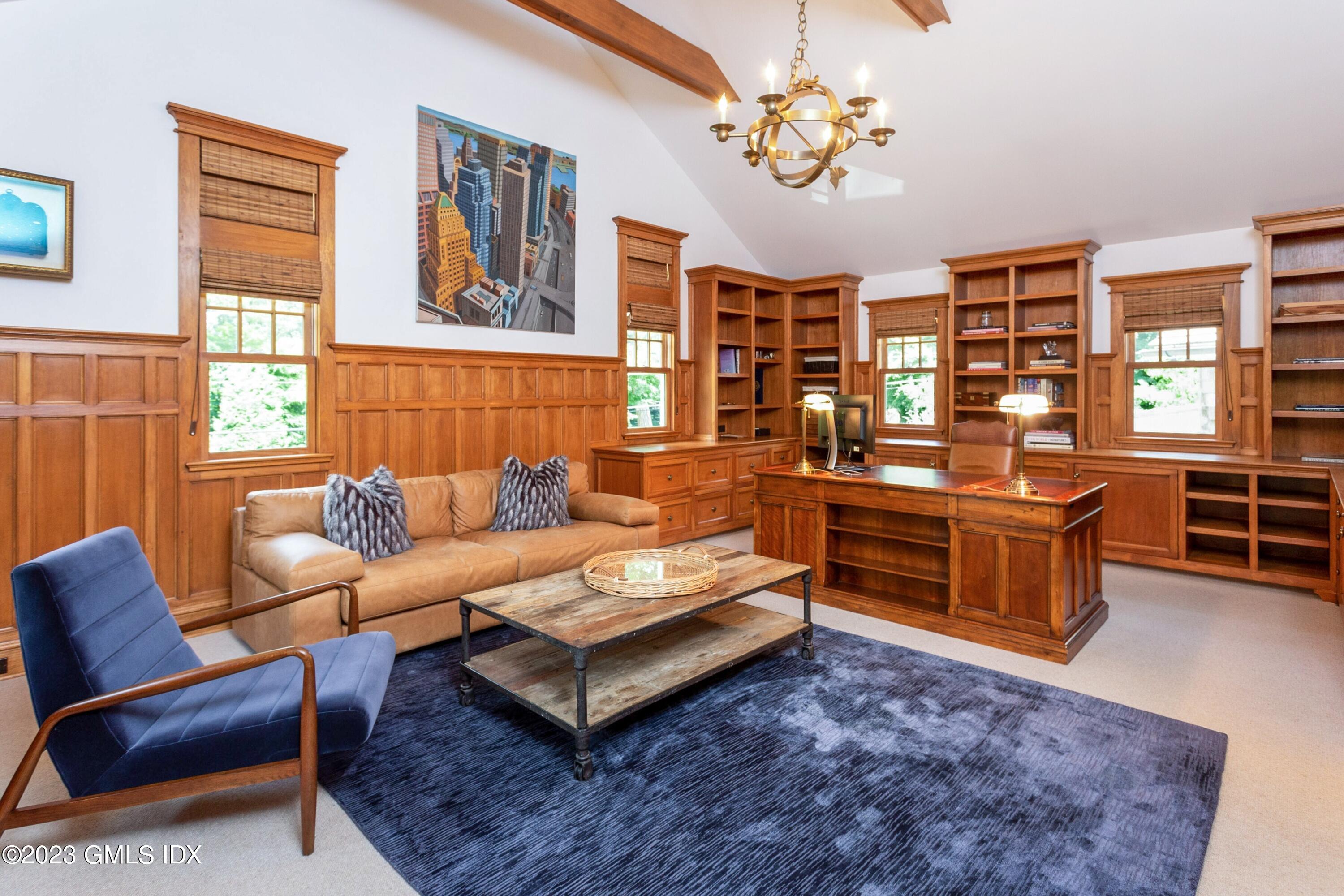 150 Goodwives River Road Darien, CT 06820 - Photo 15 of 39 a living room with furniture a lamp and large window