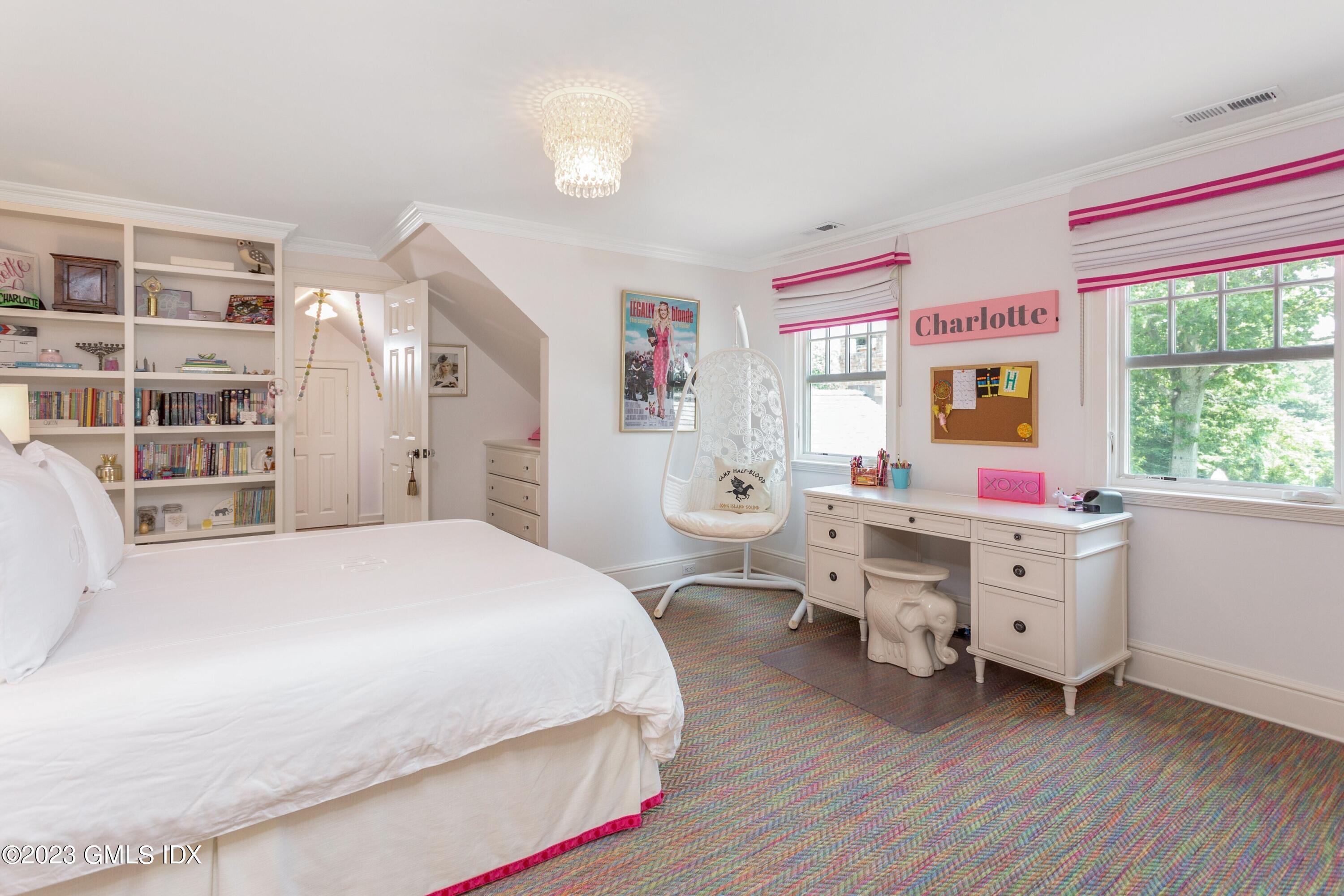 150 Goodwives River Road Darien, CT 06820 - Photo 21 of 39 a room with a bed and a large window