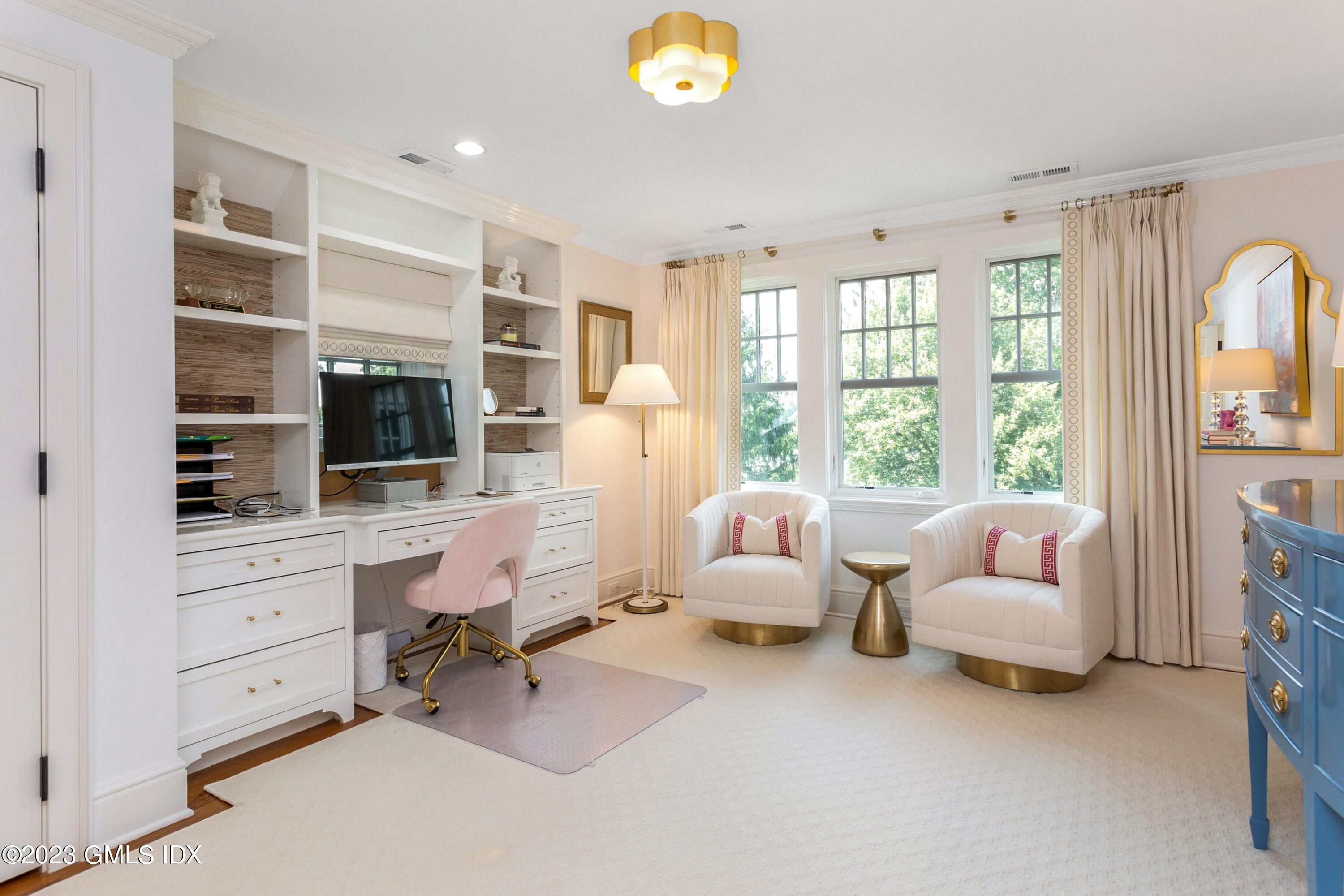 150 Goodwives River Road Darien, CT 06820 - Photo 23 of 39 a living room with furniture and a flat screen tv