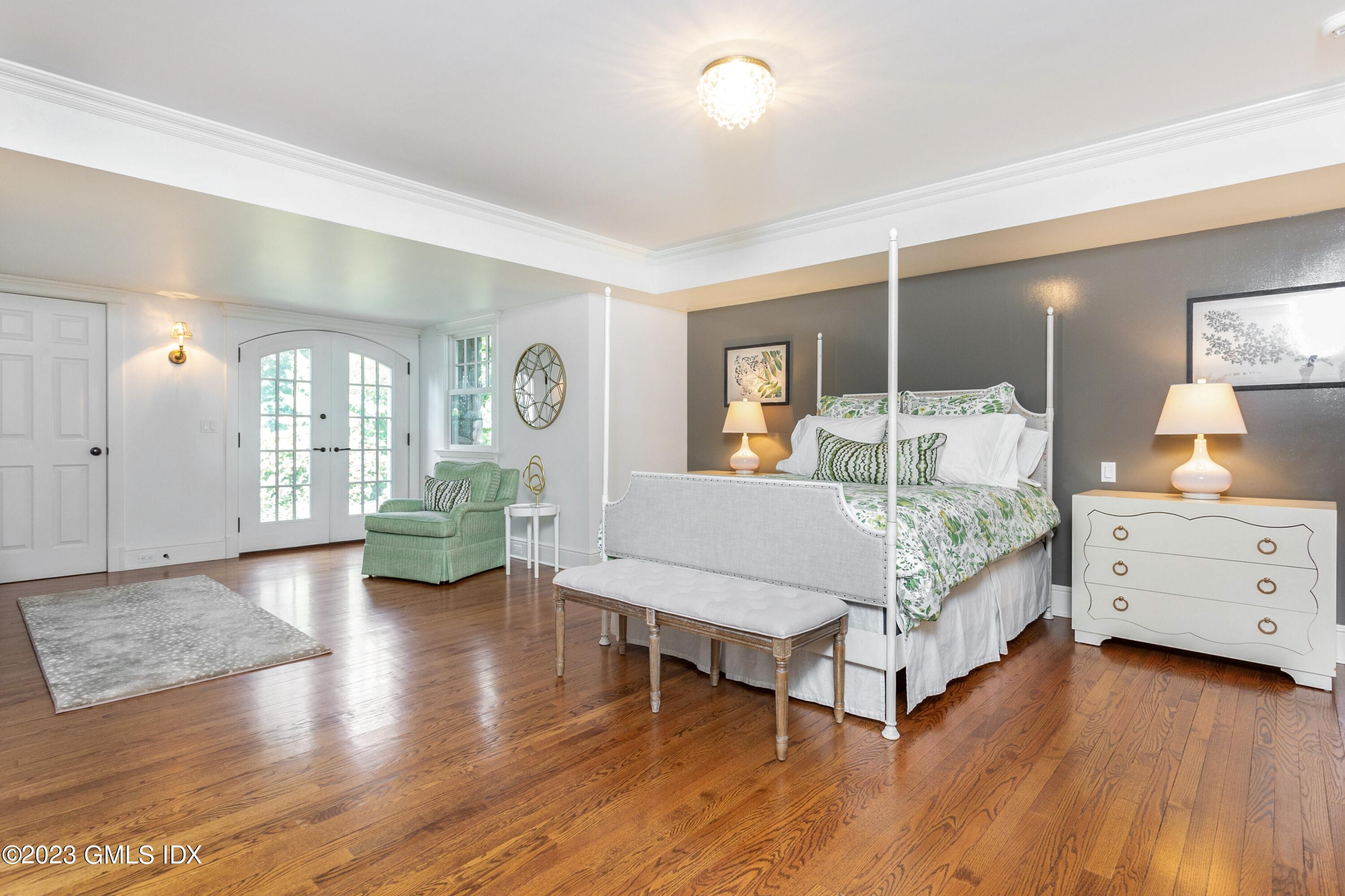150 Goodwives River Road Darien, CT 06820 - Photo 26 of 39 a bedroom with a bed and a couch