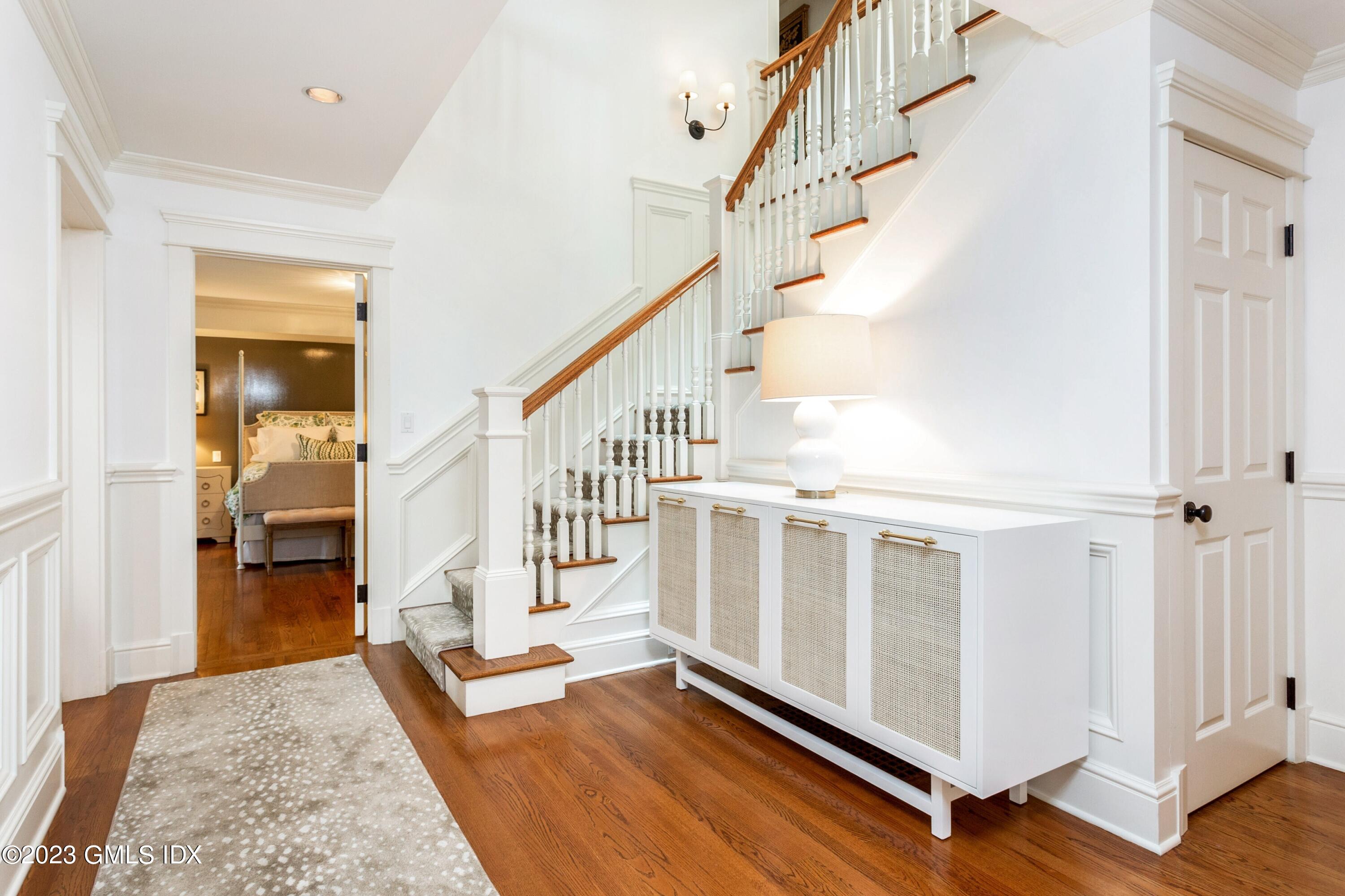 150 Goodwives River Road Darien, CT 06820 - Photo 28 of 39 a view of entryway and hall with wooden floor
