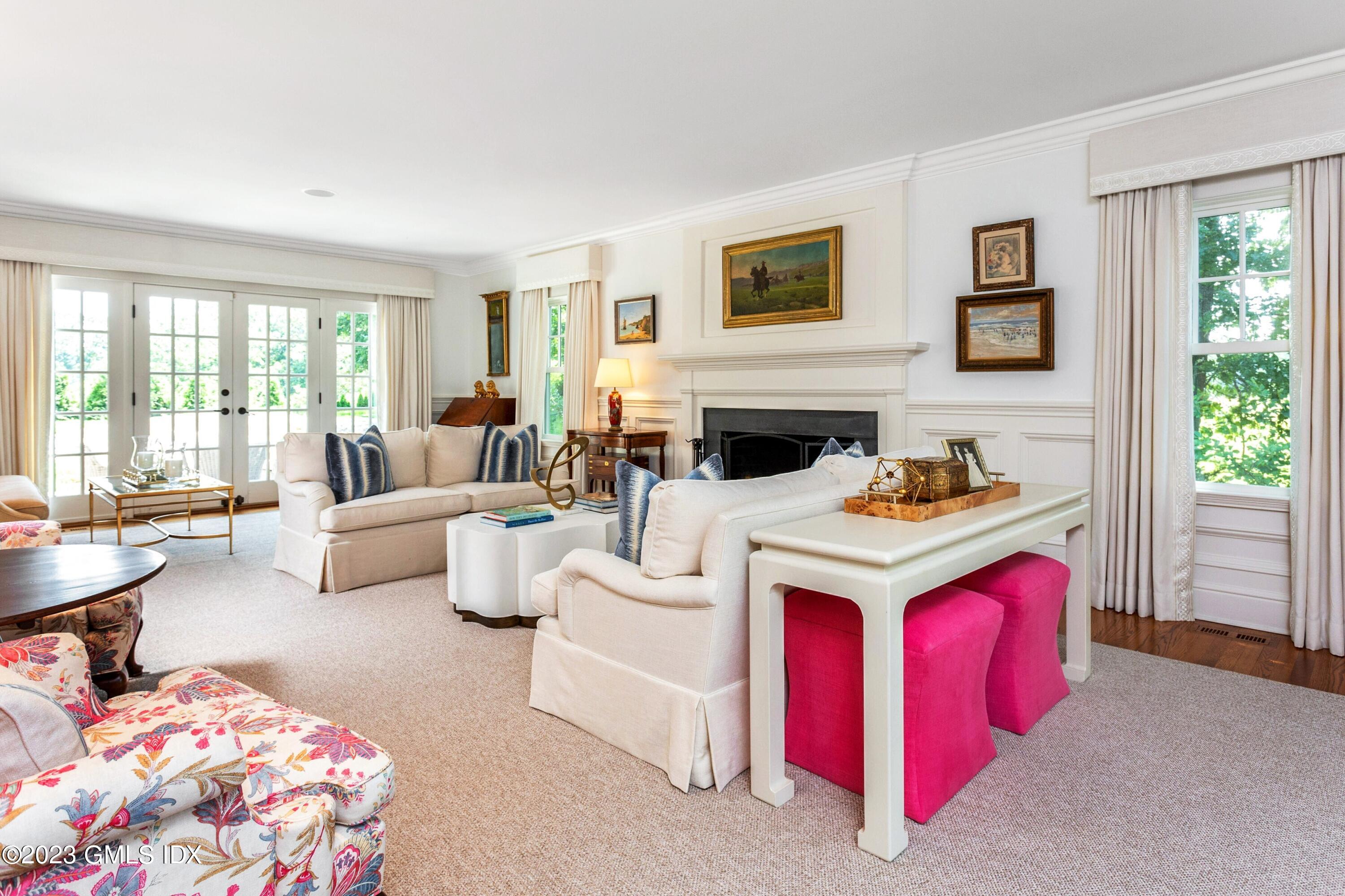 150 Goodwives River Road Darien, CT 06820 - Photo 5 of 39 a living room with furniture and windows