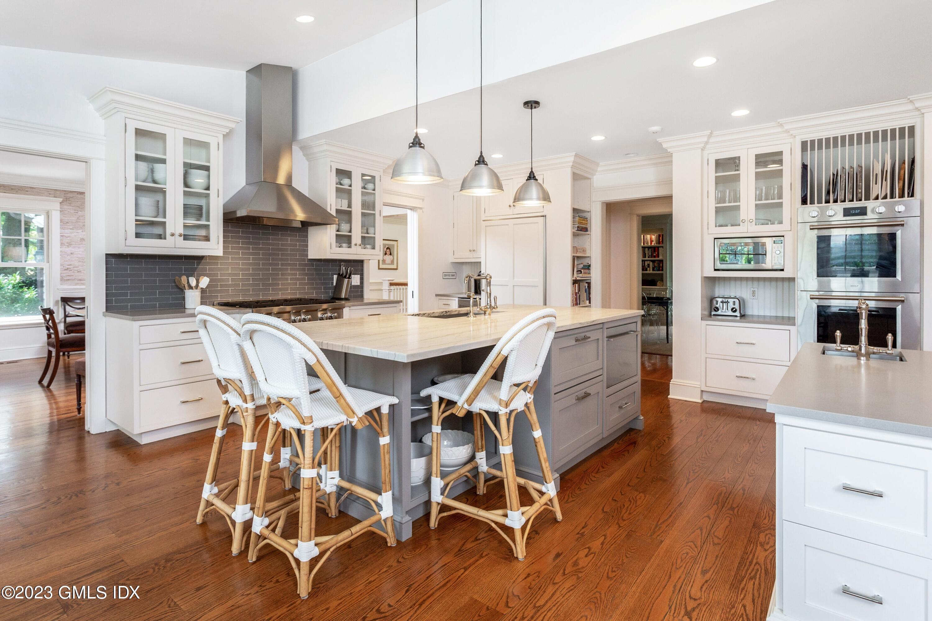 150 Goodwives River Road Darien, CT 06820 - Photo 10 of 39 a view of a dining room with furniture and wooden floor