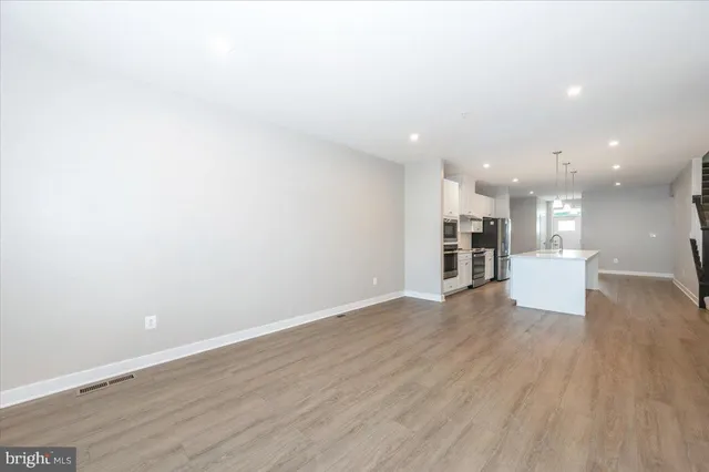 a view of a balcony with wooden floor