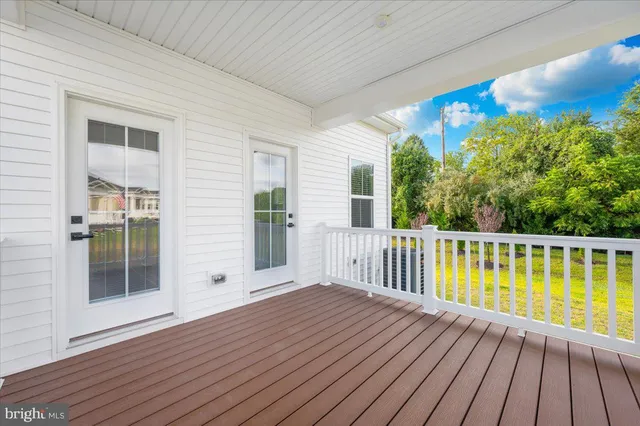 a spacious bathroom with double sink and a mirror