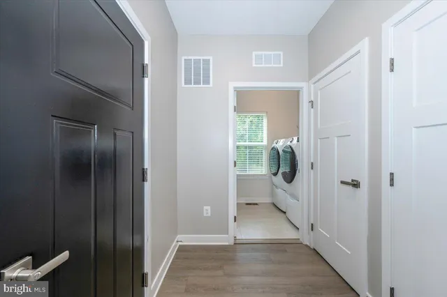 a view of wooden floor and windows in a room