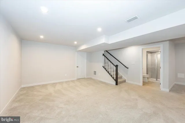a view of a room with wooden walls
