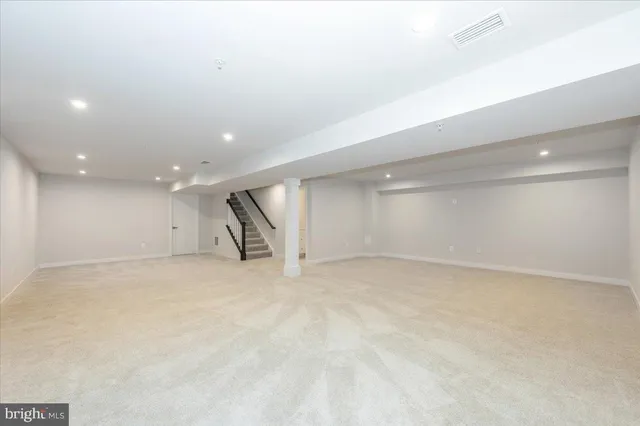 a view of a house with a yard balcony and sitting area