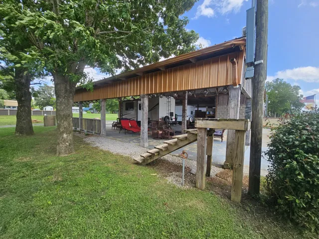 a view of a park that has a sign board
