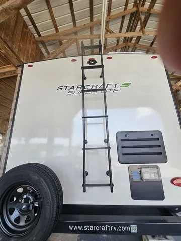 a sign broad in front of a house