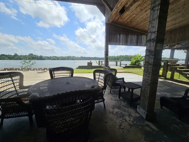 a front view of a house with a yard table and chairs