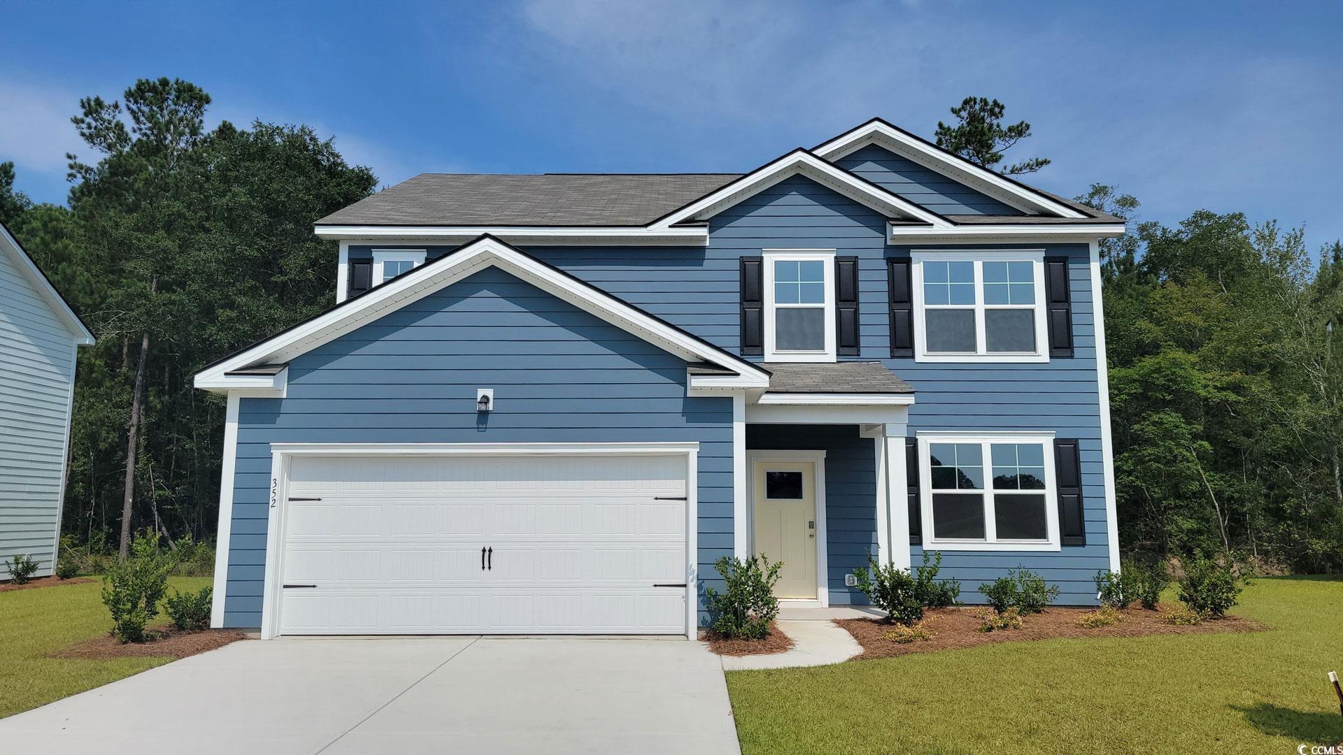 352 Rookroost Circle Conway, SC 29526 - Photo 1 of 32 View of front of property featuring concrete driveway, a front yard, and a garage