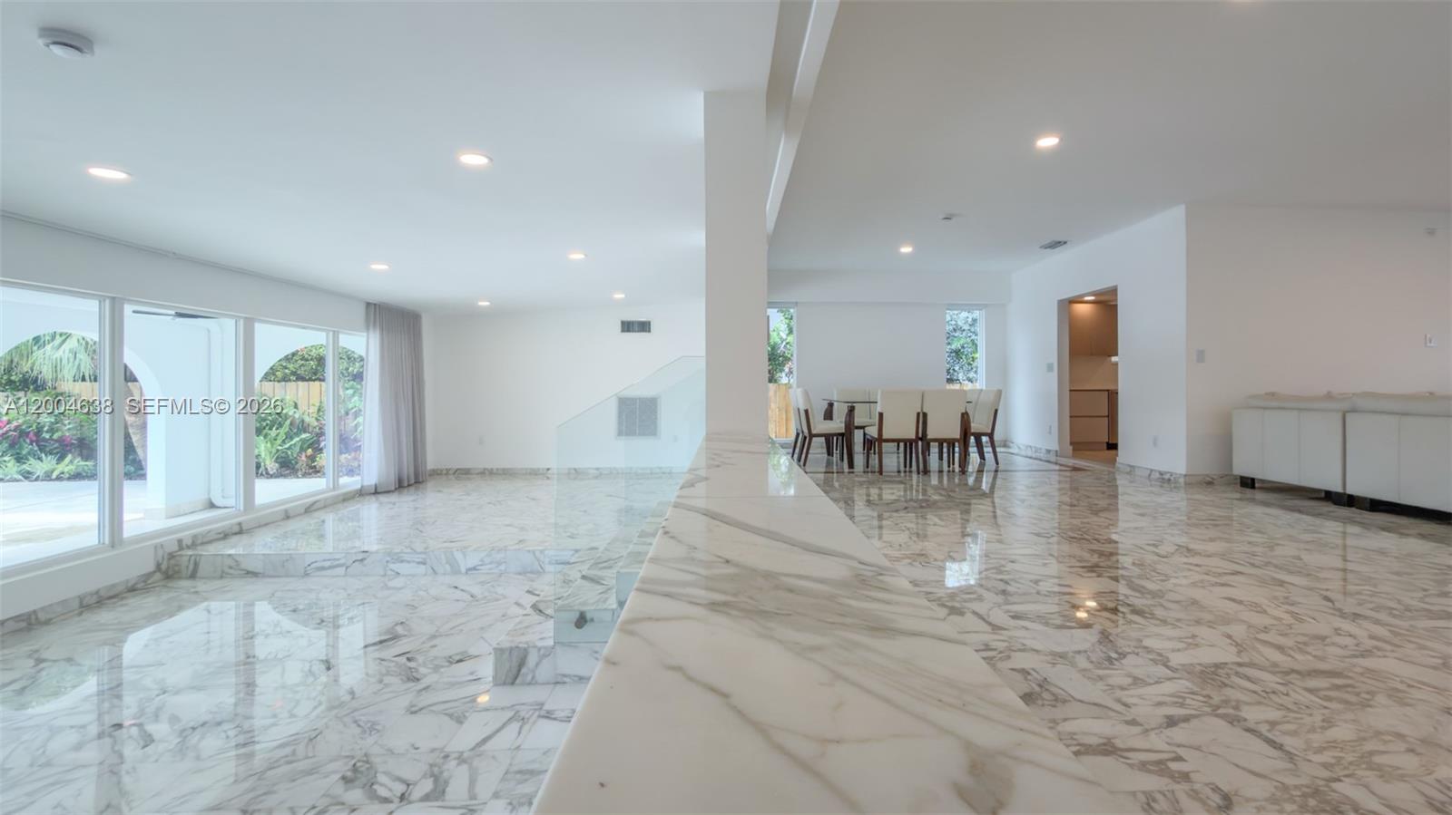 1690 Daytonia Road Miami Beach, FL 33141 - Photo 23 of 88 a view of a living room and a floor to ceiling window