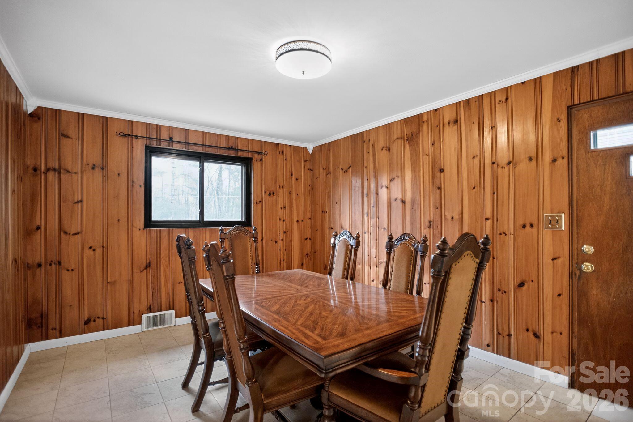 4783 Calico Road Lenoir, NC 28645 - Photo 11 of 44 a view of a dining room with furniture and chandelier