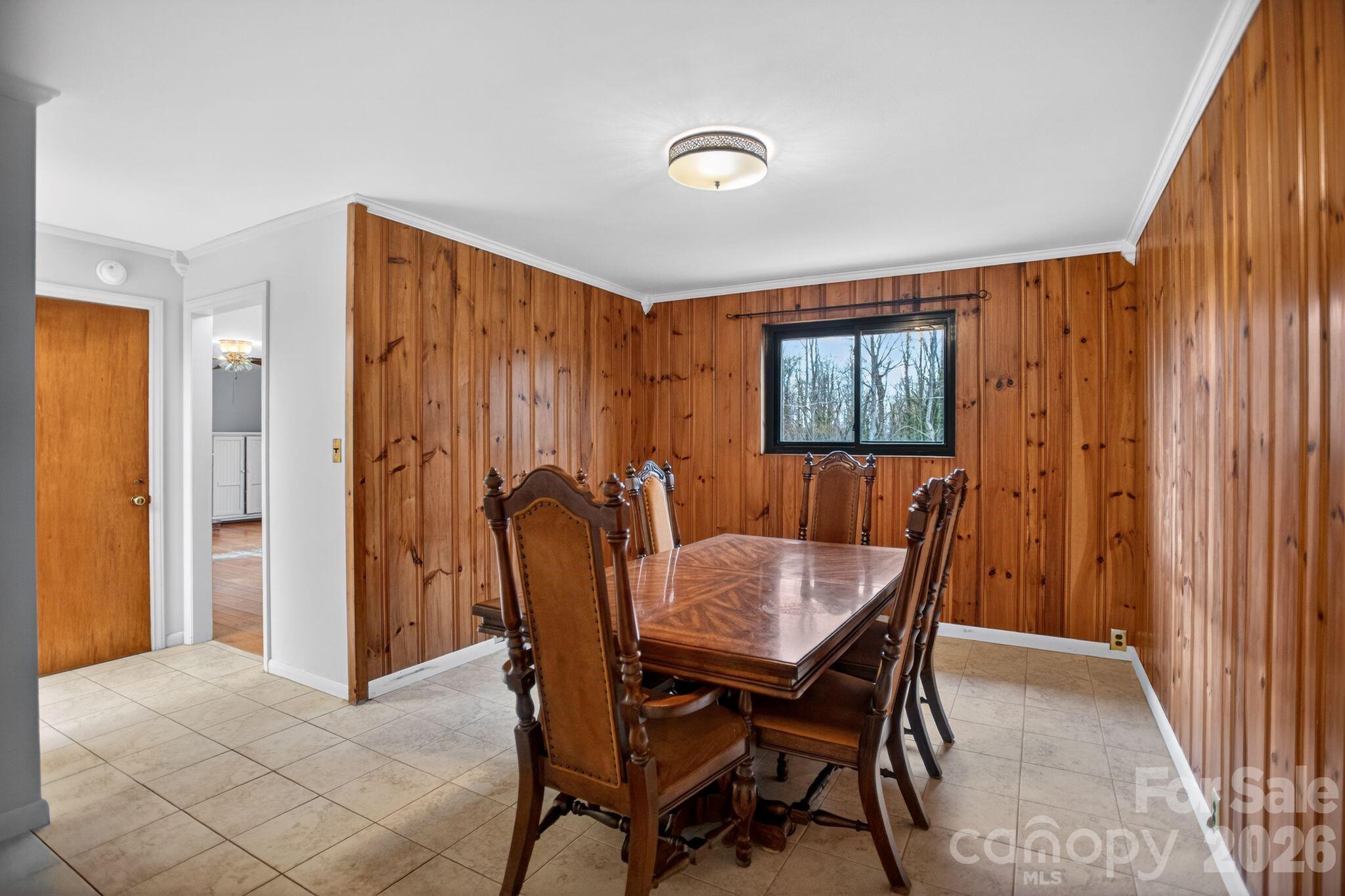 4783 Calico Road Lenoir, NC 28645 - Photo 12 of 44 a view of a dining room with furniture and window