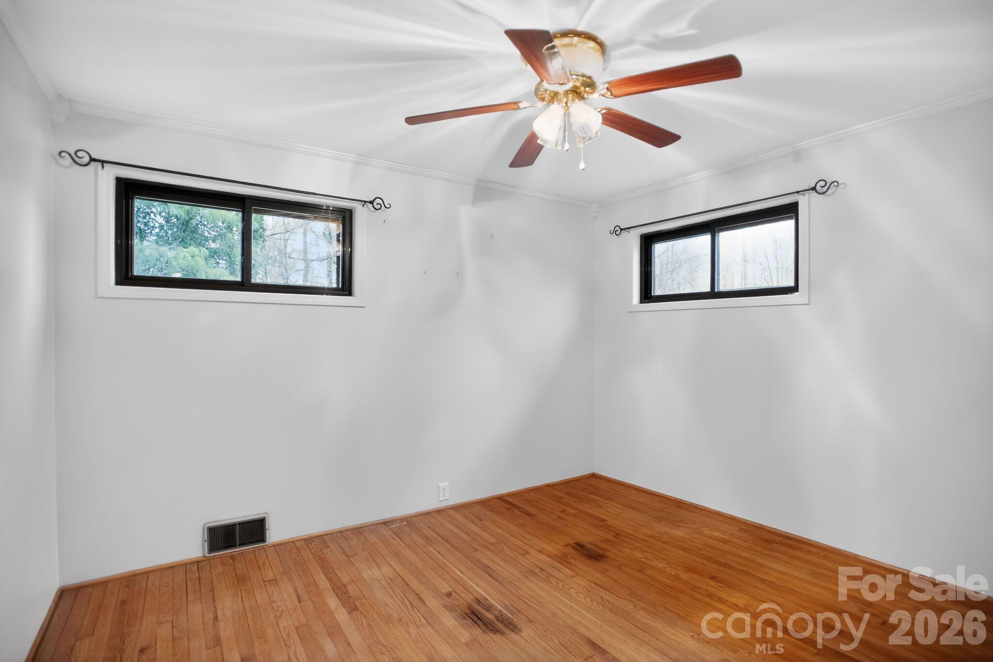 4783 Calico Road Lenoir, NC 28645 - Photo 16 of 44 a view of empty room with wooden floor