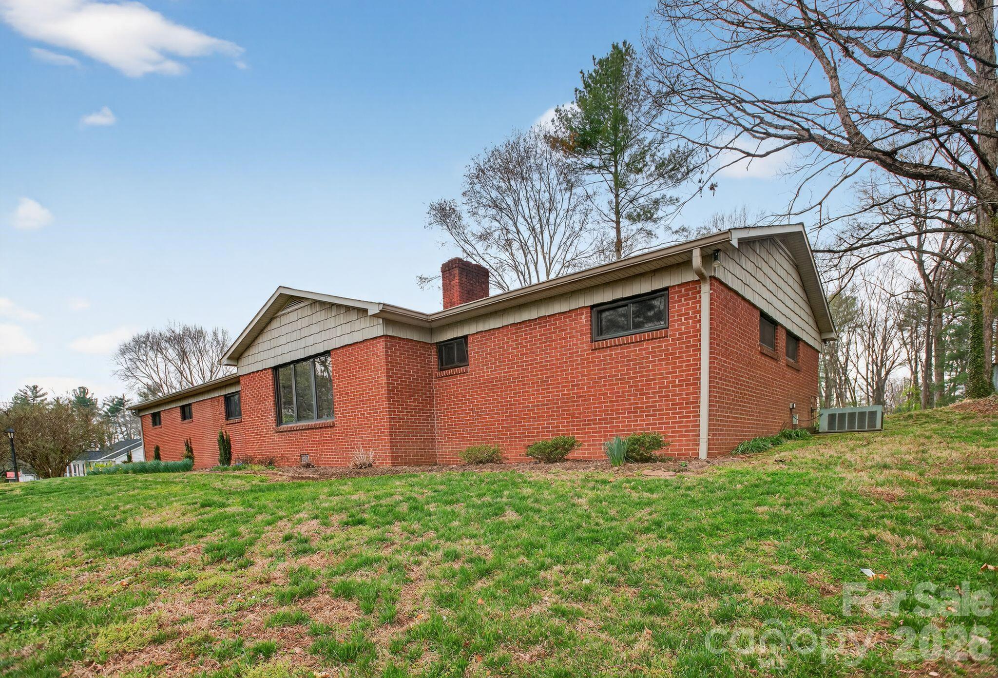 4783 Calico Road Lenoir, NC 28645 - Photo 2 of 44 a front view of a house with garden